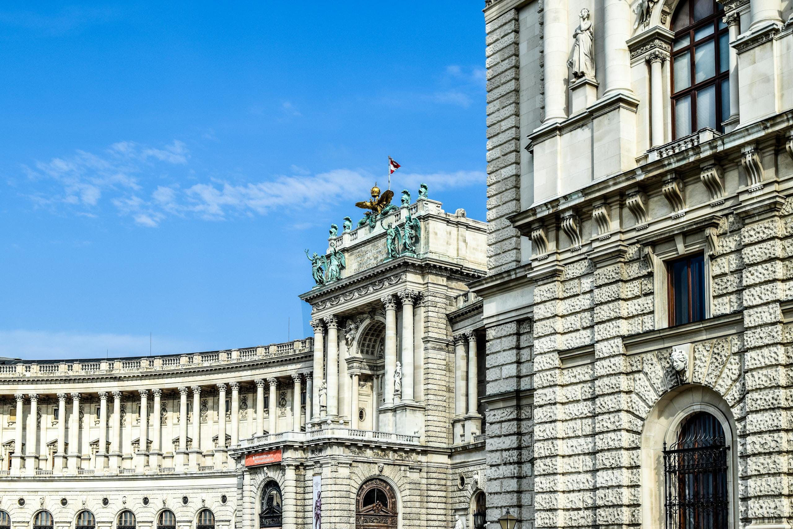 Stafford Affiliates Travel - Stunning view of Vienna's Hofburg Palace exterior, showcasing its architectural grandeur against a clear blue sky.