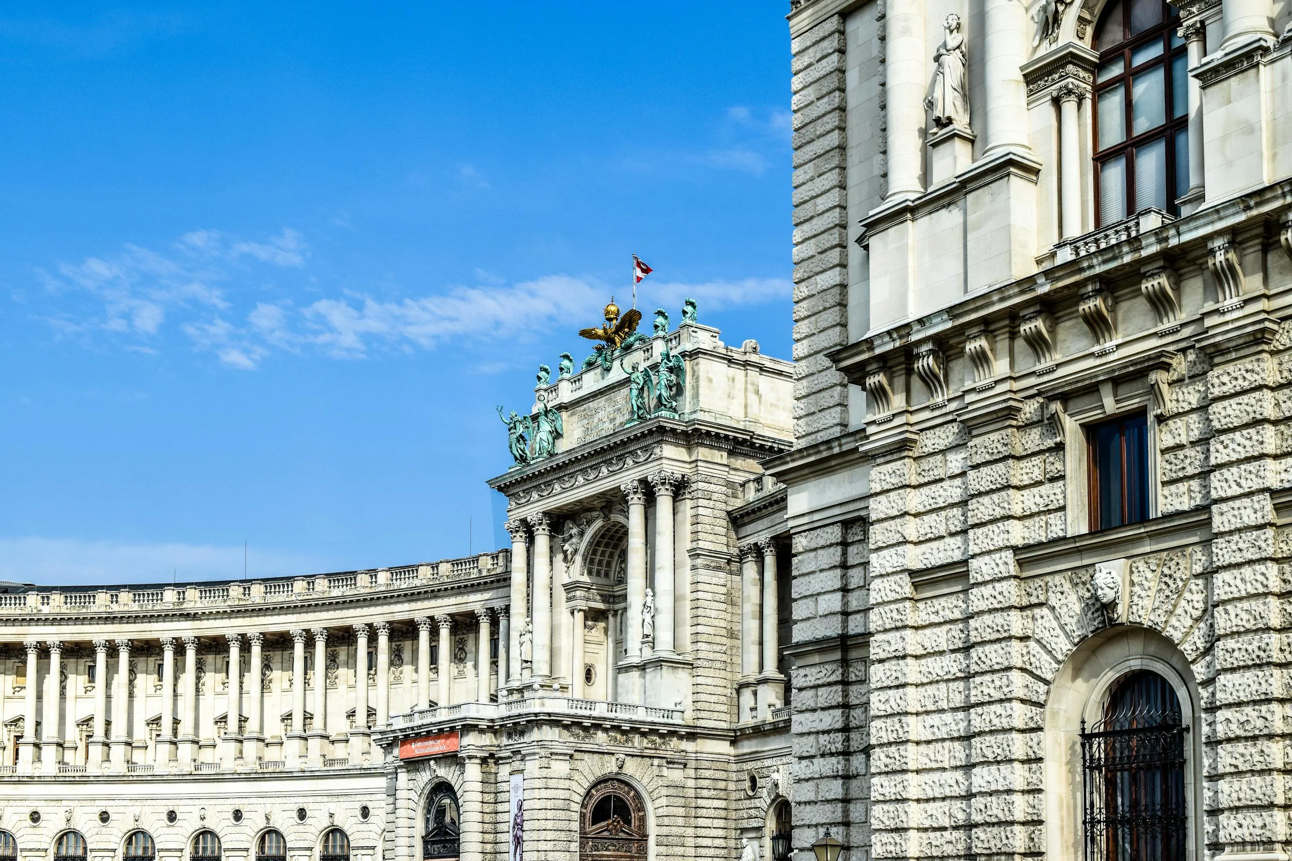 Stafford Affiliates Travel - Stunning view of Vienna's Hofburg Palace exterior, showcasing its architectural grandeur against a clear blue sky.