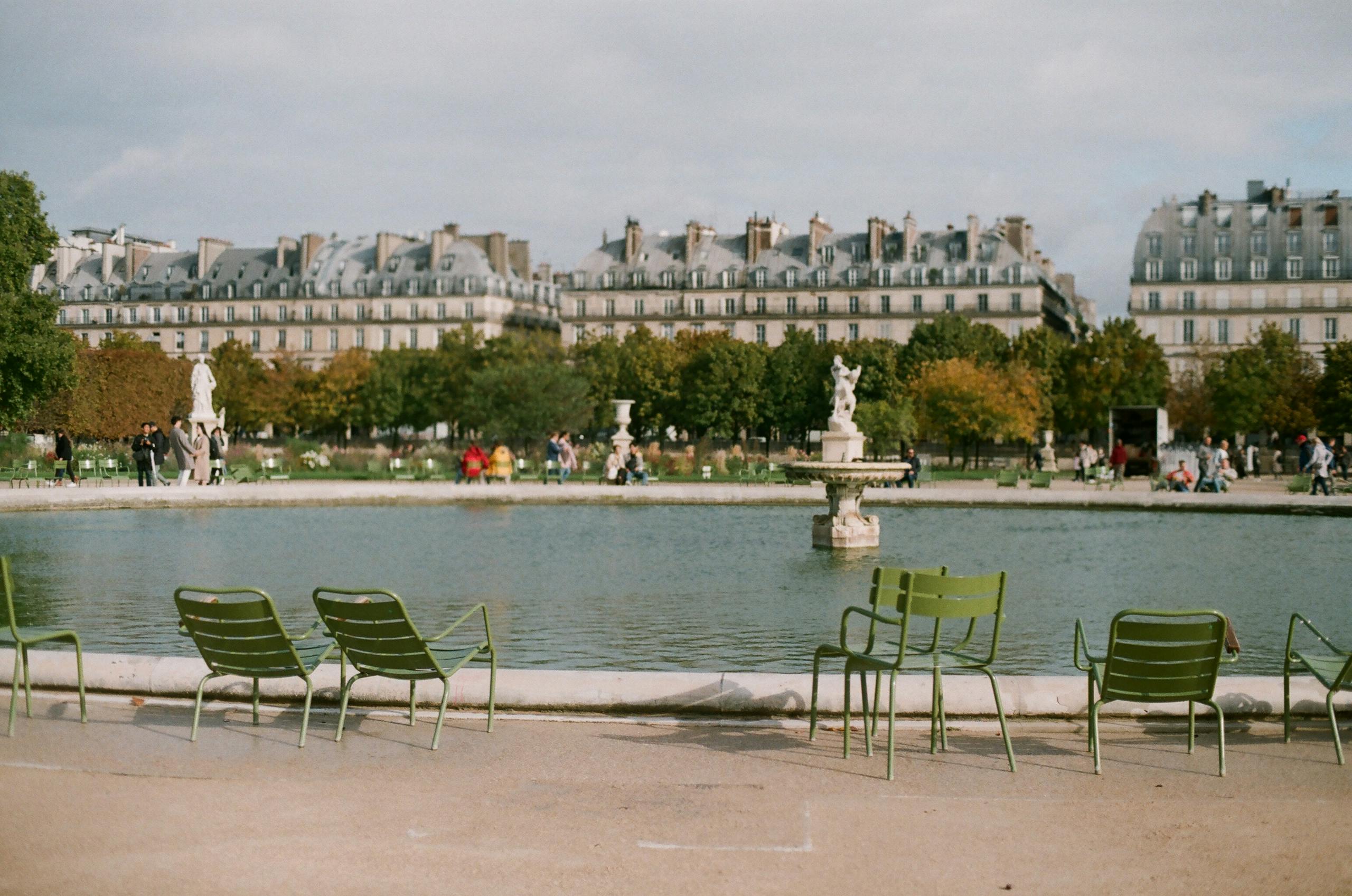 Stafford Affiliates Travel - Charming scene of the Tuileries Garden with iconic Parisian architecture and a peaceful fountain view.