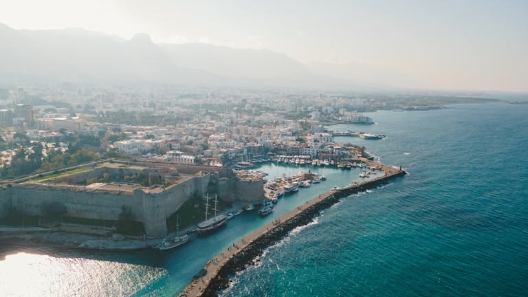 A breath-taking aerial view of Kyrenia Castle and the bustling harbour in Cyprus - Stafford Affiliates Travel