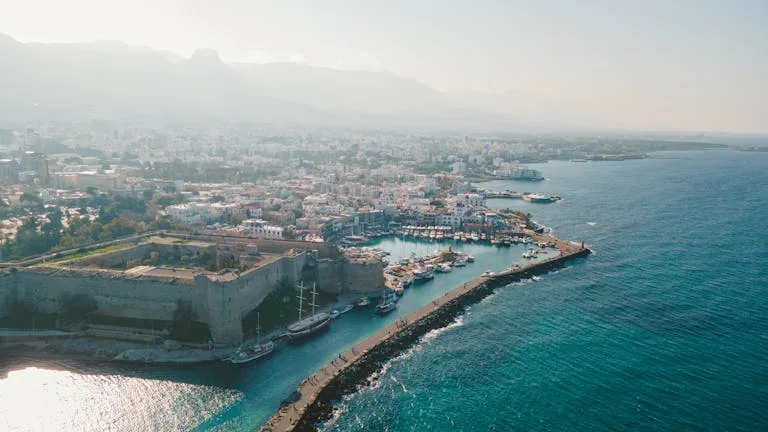 A breath-taking aerial view of Kyrenia Castle and the bustling harbour in Cyprus - Stafford Affiliates Travel