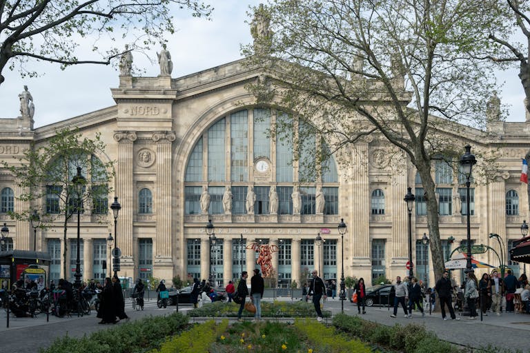 Capture of Gare du Nord in Paris showing classic architecture and bustling daily life. Stafford Affiliates Travel
