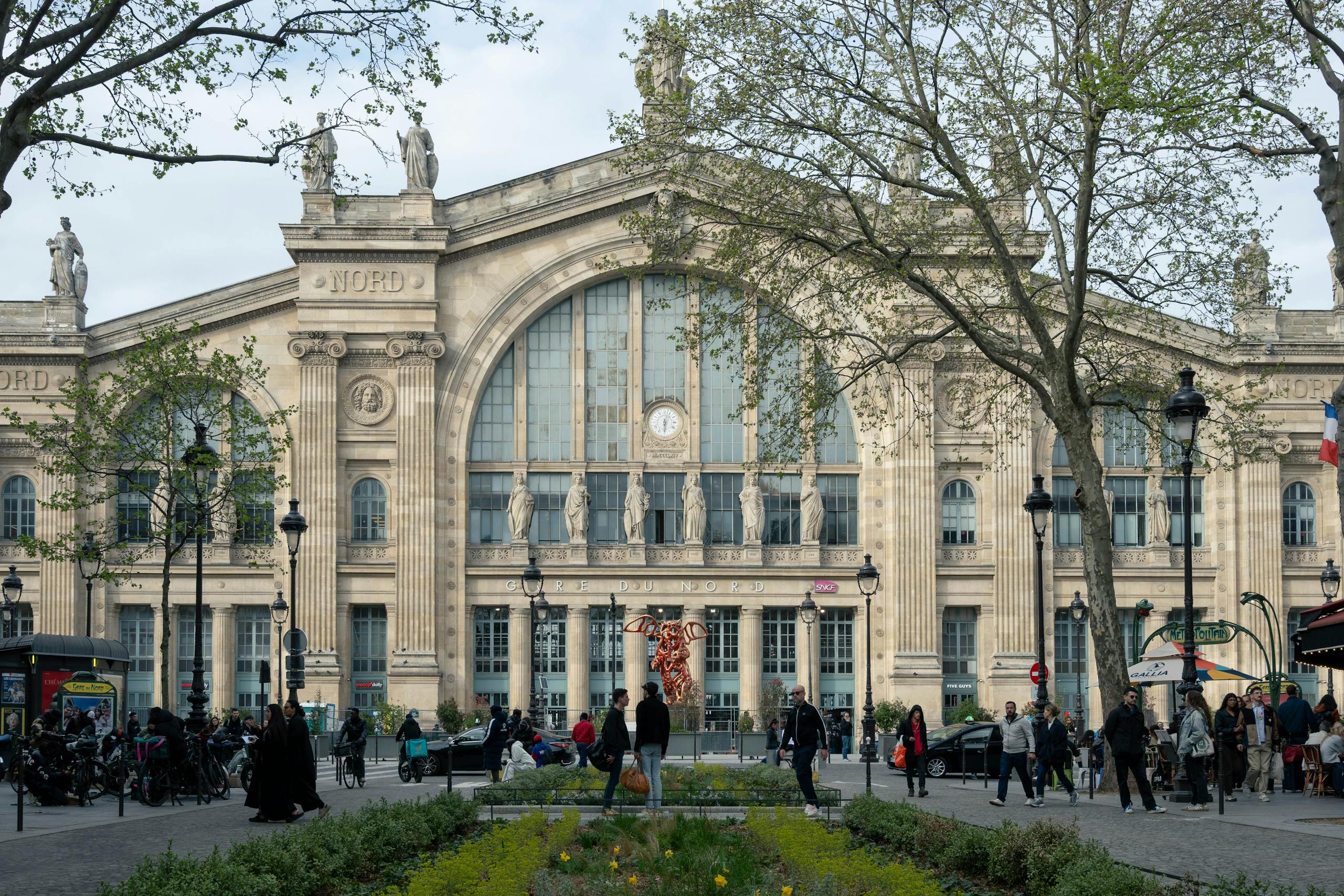 Capture of Gare du Nord in Paris showing classic architecture and bustling daily life. Stafford Affiliates Travel