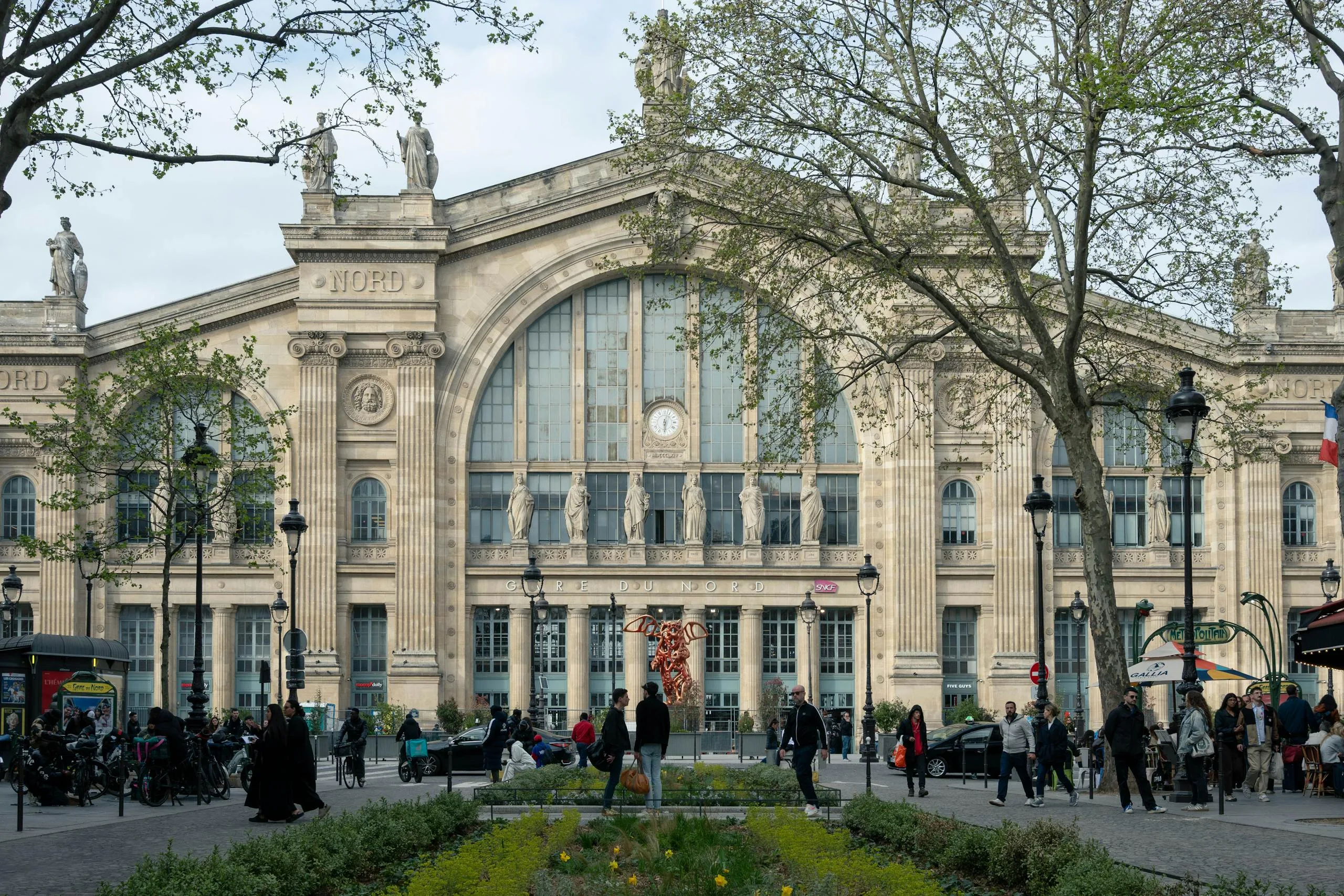 Capture of Gare du Nord in Paris showing classic architecture and bustling daily life. Stafford Affiliates Travel