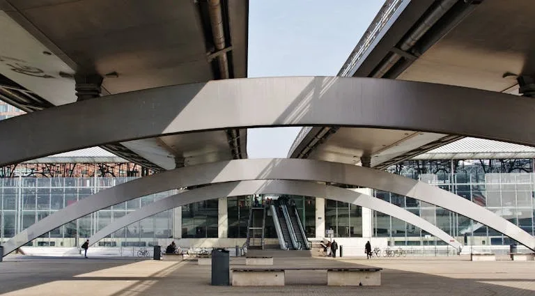 Contemporary bridge architecture in Lille Europe Railway Station, France with urban design elements. Stafford Affiliates Travel