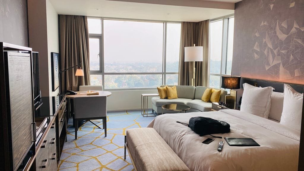 Elegant hotel suite with modern design and city view in Bengaluru. - Stafford Affiliates Travel